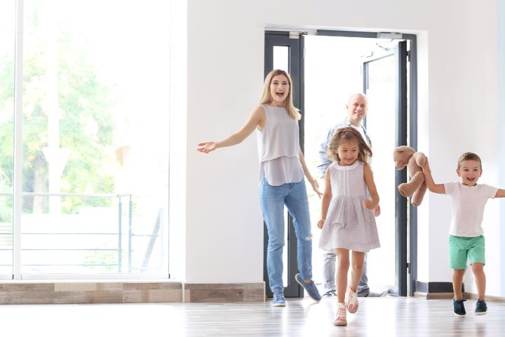 happy family entering new home