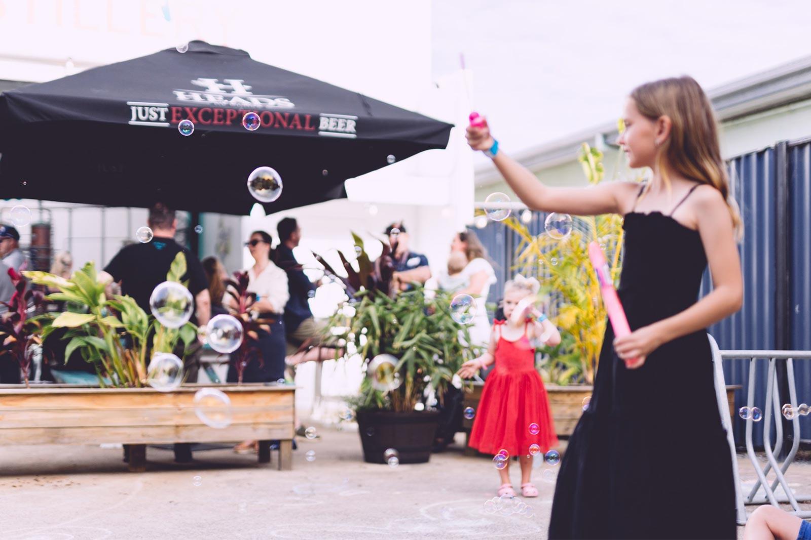 little girl with bubbles at christmas party